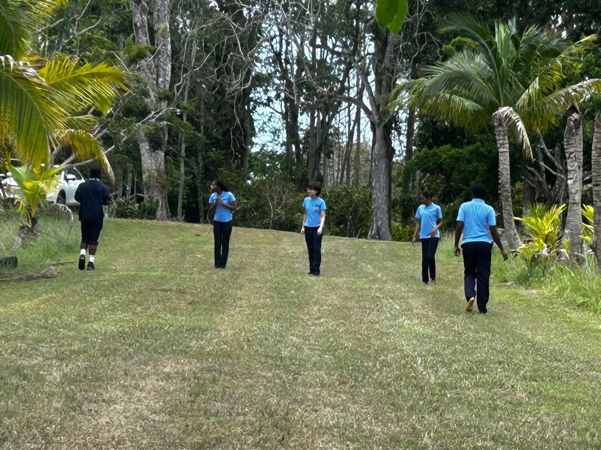 Students walking outdoors on a school trip